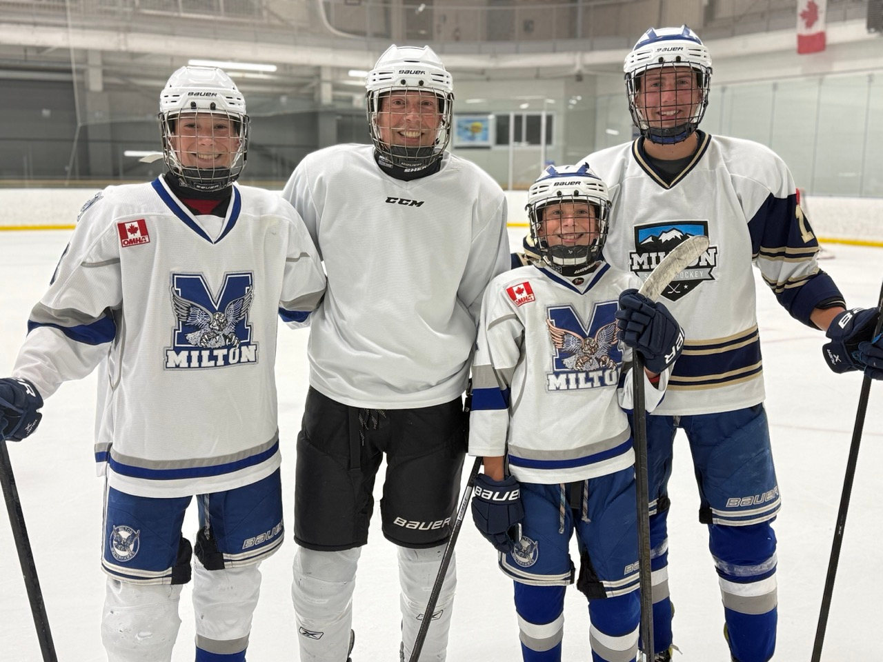 A family of four in MSH jerseys on the ice