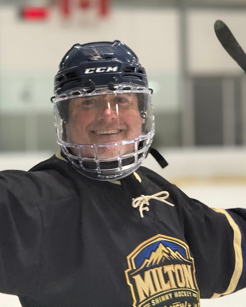 A smiling MSH member in the Blackout jersey at Wednesday night shinny