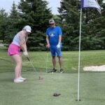 Meagan Hewlett Putting  at MSH Annual Charity Golf Tournament at Turtle Creek Friday June 2nd 2023 with a turtle near the hole.